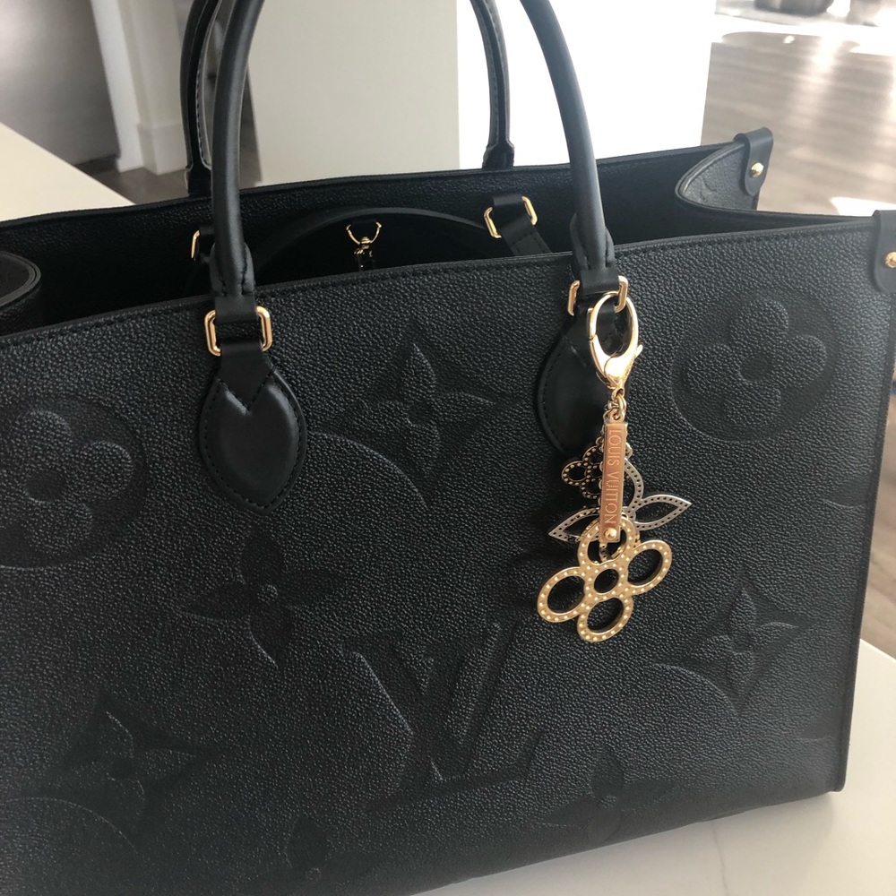 Louis Vuitton  black leather on the go.